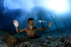 A kid from raja ampat by Ag Hu 